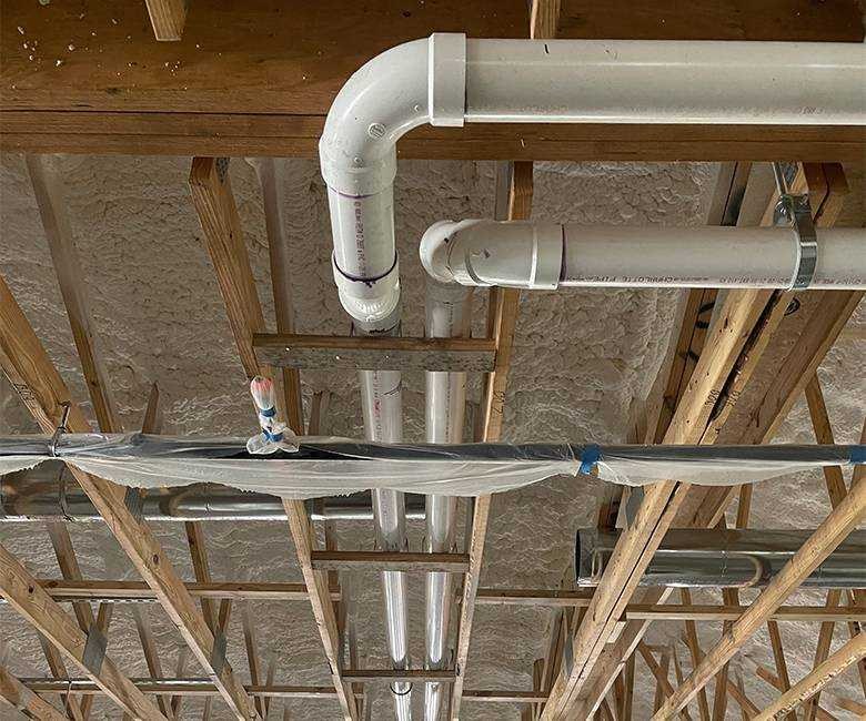 Plumber at work on a residential plumbing system