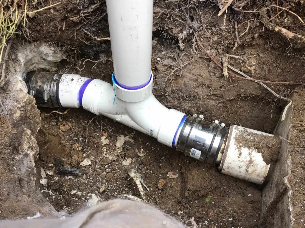 Sewer line replacement in an excavated trench